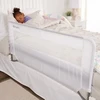 Regalo swing down toddler bed rail guard installed on a bed to prevent falls