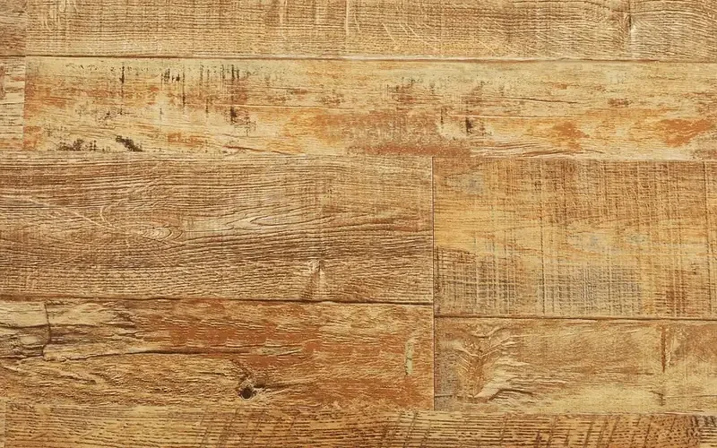 Wood-look plank flooring with rough-sawn texture and worn finish