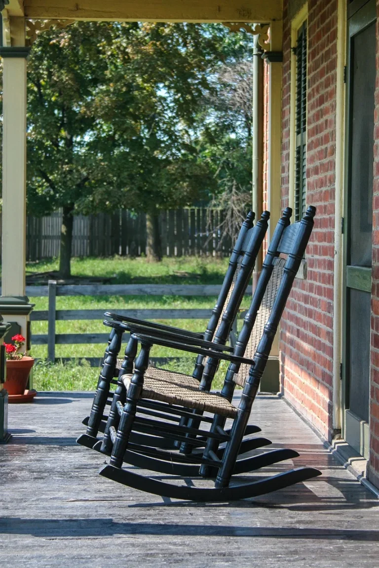 Handcrafted wooden rocking chair on a porch
