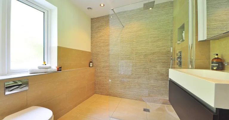 Bathroom with natural stone tile flooring and walk-in shower