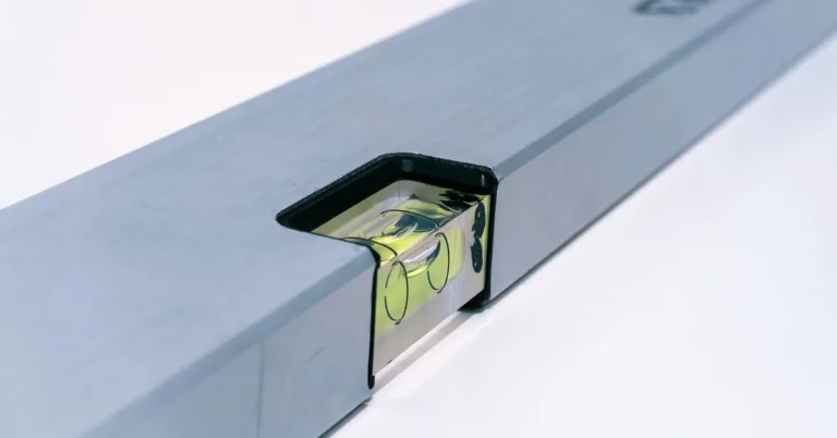 Spirit level bubble used to check a subfloor for flatness before installing wood flooring