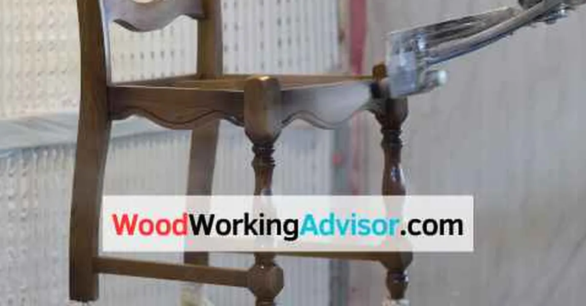Wood chair mid-spray-paint with primer coat, an example of spray painted outdoor furniture prep