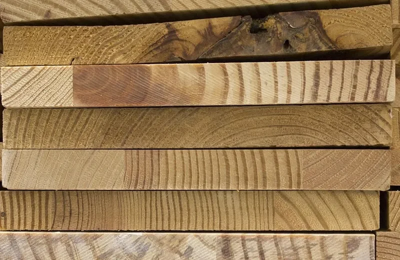 Edge view of stacked pine boards showing board thickness Edge view of stacked pine boards showing board thickness