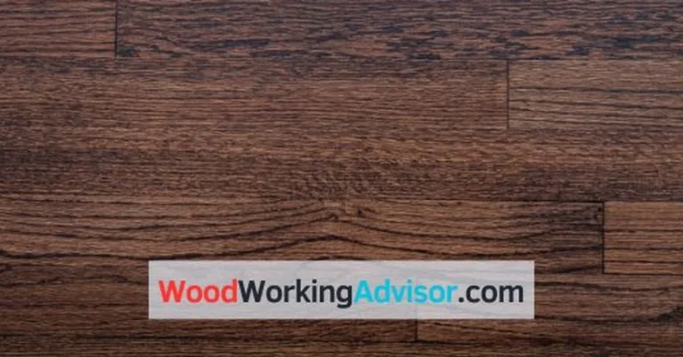 Close-up of dark stained wood floor planks after staining darker