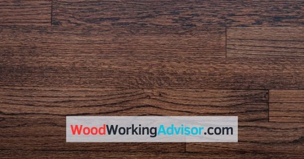 Close-up of dark stained wood floor planks after staining darker