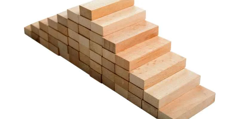 A stepped pyramid built from stacked, progressively smaller wood blocks