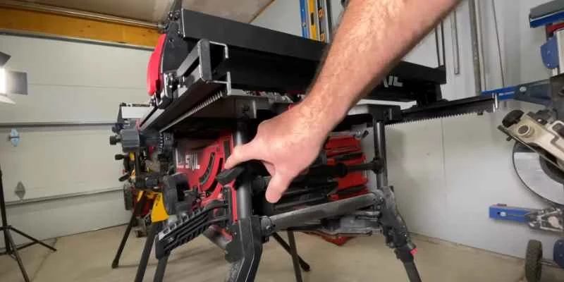 Table saw dust port connected to a collection hose