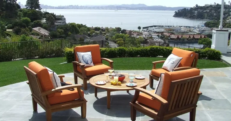 weathered golden teak outdoor patio furniture showing natural teak color