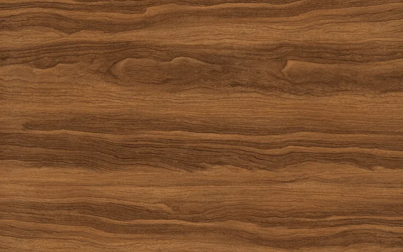 teak wood surface showing natural grain swirl and rich brown tone teak wood surface showing natural grain swirl and rich brown tone