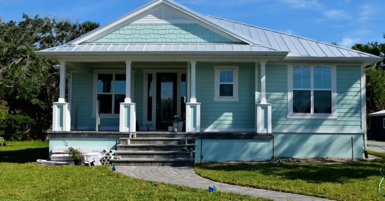Modern house exterior with a glass-paneled front entry door during construction