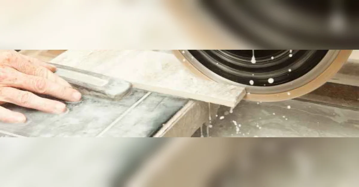 Wet saw diamond blade cutting porcelain tile with water cooling the cut