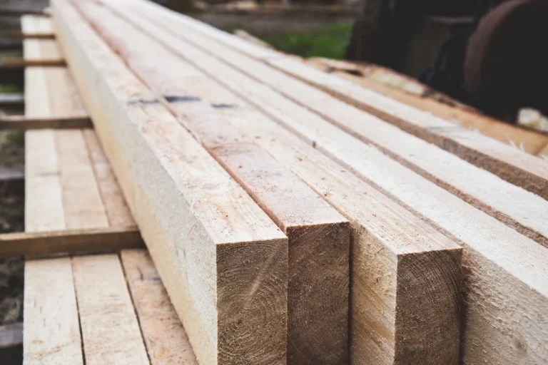 Freshly milled whitewood SPF dimensional lumber boards stacked at a lumber yard