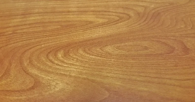 Swirling figured wood grain pattern close-up