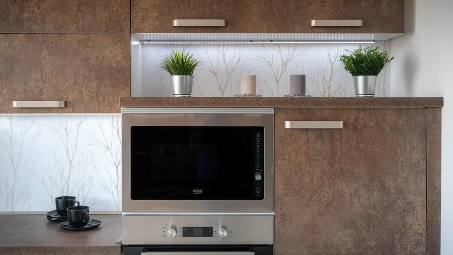 Slab-style kitchen cabinet doors with a wood-grain laminate finish