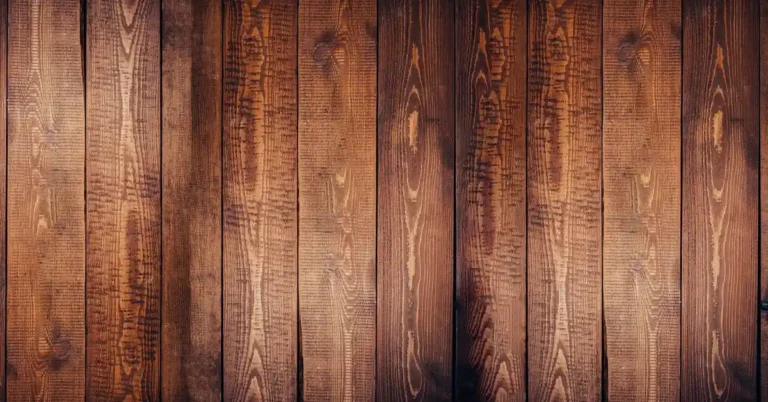 rows of warm brown wood planks installed vertically on an accent wall
