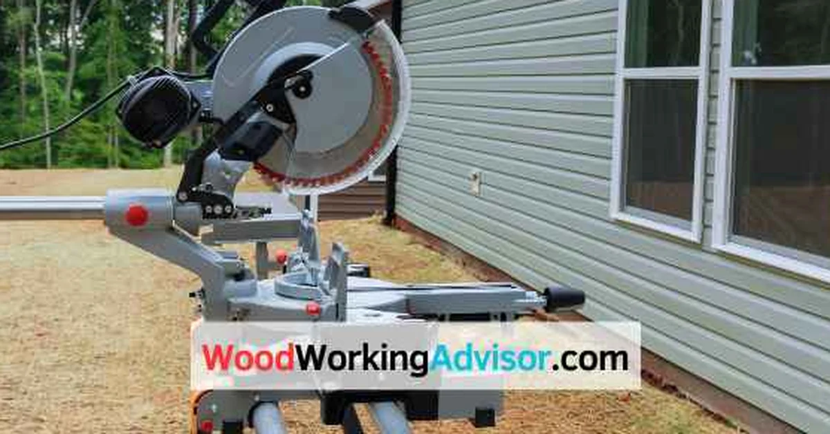 10-inch miter saw with blade and fence showing what sets its maximum cutting width