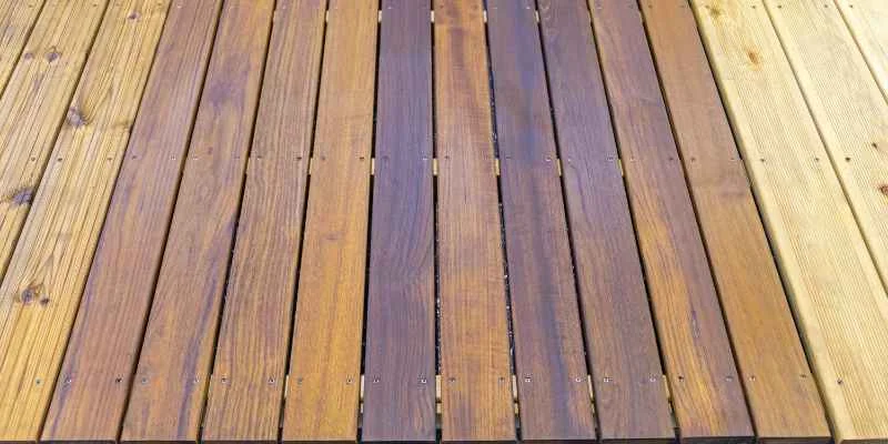 Finished deck boards with visible screw fasteners driven at each board crossing