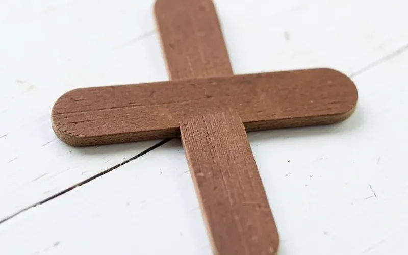 Handmade wooden cross craft made from two glued popsicle sticks Handmade wooden cross craft made from two glued popsicle sticks