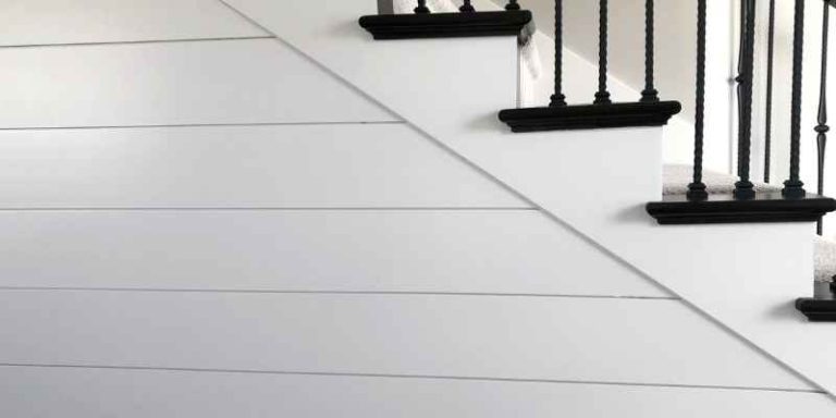 White shiplap wall with finished edges installed along a staircase