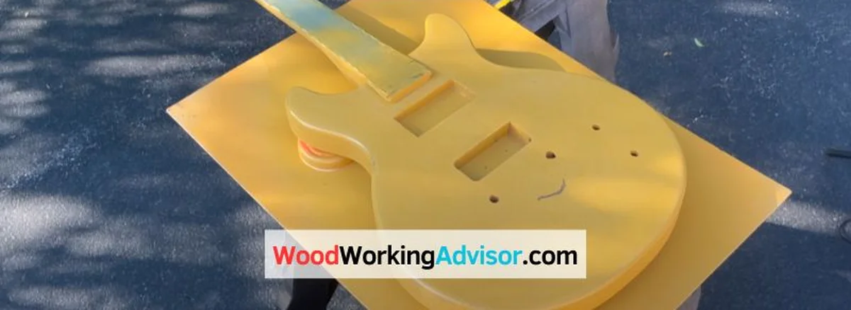 ACX plywood sheet cut into a guitar body blank during a woodworking project