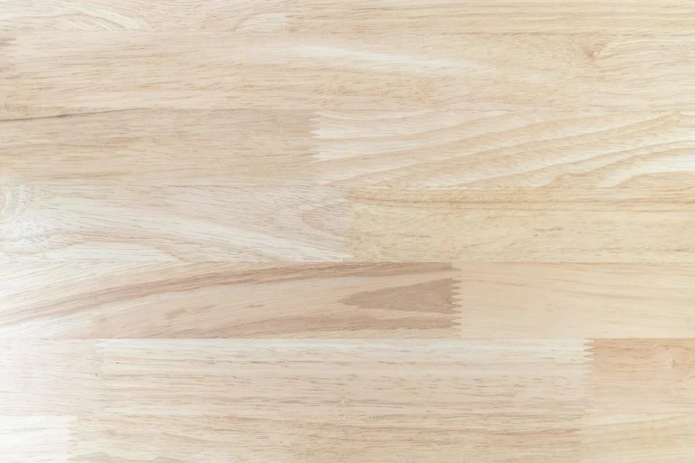 Light-colored pine wood planks showing natural grain and knots