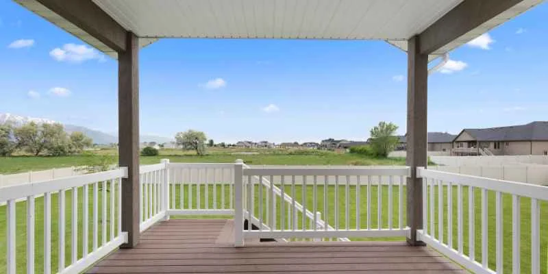 Composite decking on a covered porch overlooking a backyard
