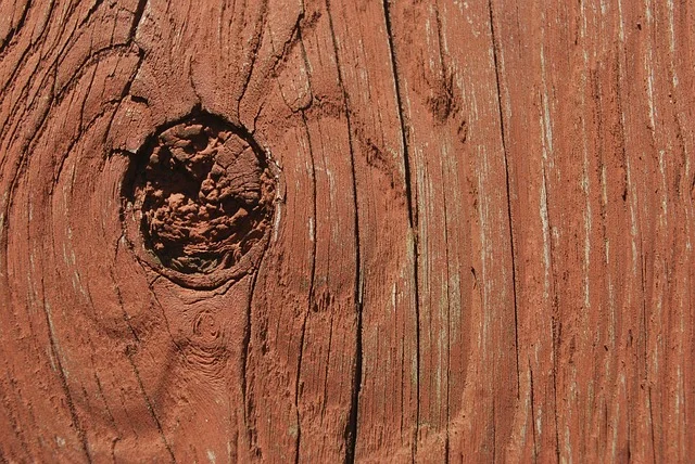 Close-up of a knotty, reddish heartwood redwood board, the type of grain typical of Construction Heart grade lumber