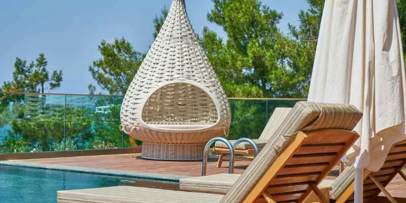 Wood deck serving as a backdrop for a pool lounge area