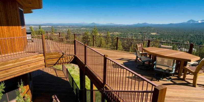 Deck overlooking a wildland hillside setting where fire-resistant decking matters