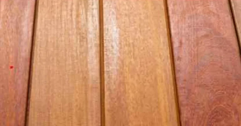 Close-up of dense hardwood decking boards showing tight, straight grain