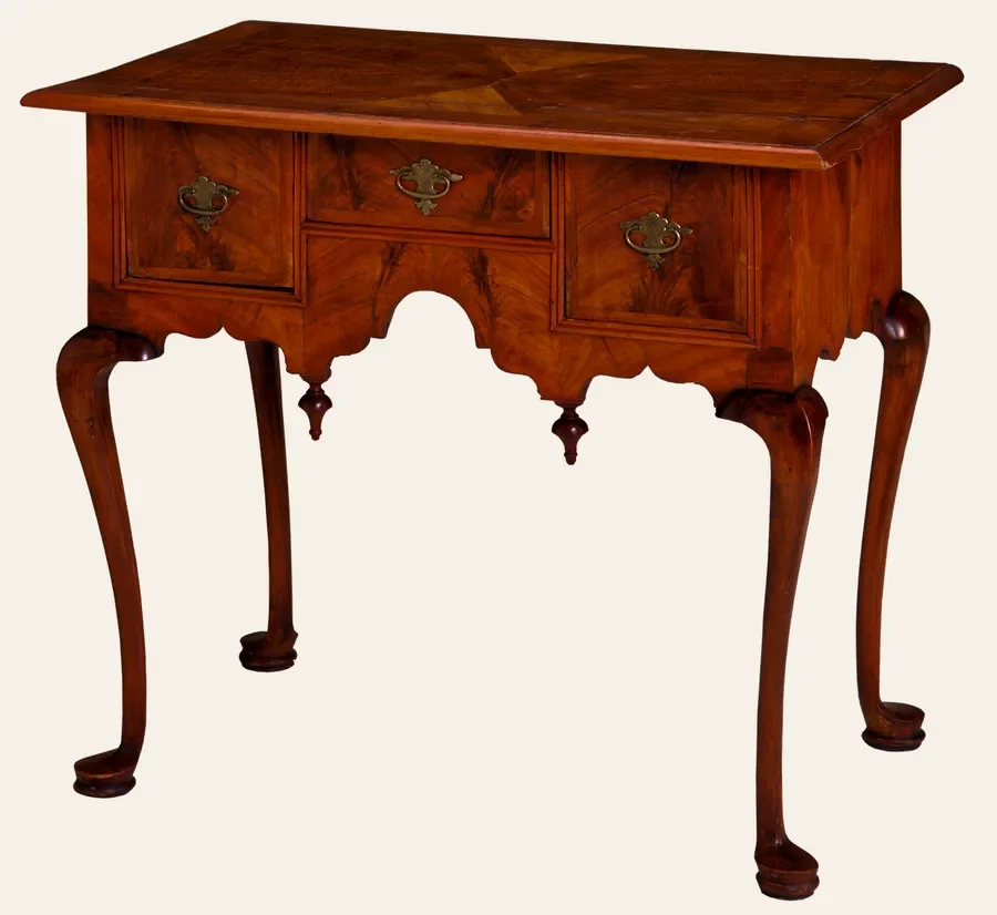 Antique lowboy table with figured walnut veneer on the top and drawer fronts