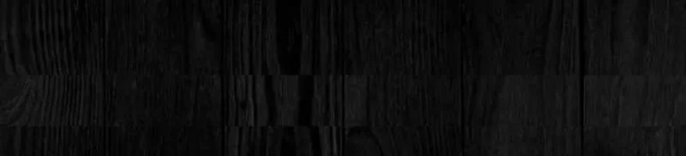 Close-up of dark stained wood grain texture on ash boards