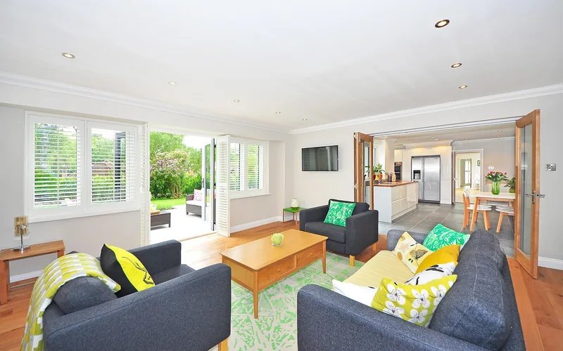 modern living room with light hardwood floor and open-plan seating area modern living room with light hardwood floor and open-plan seating area