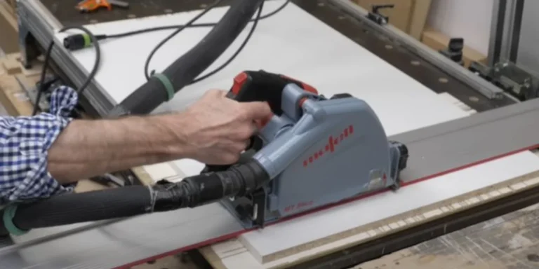 Mafell MT 55cc track saw cutting plywood on a guide rail