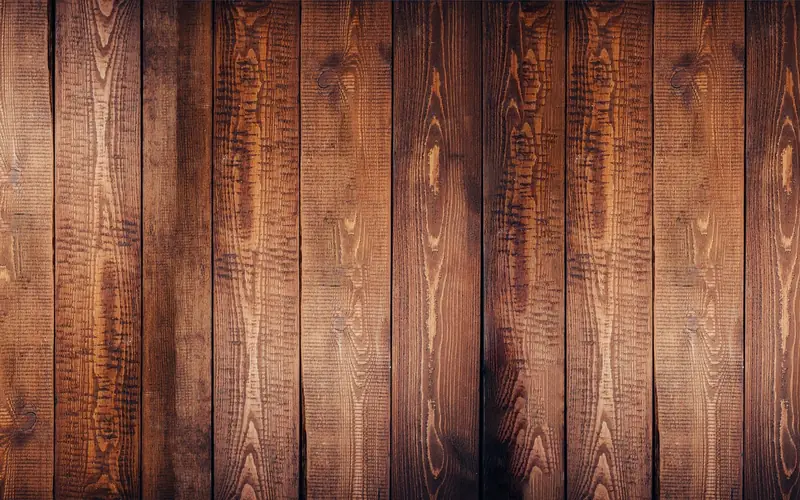 Close-up of hardwood plank grain showing tight, closed wood fibers typical of dense hardwoods like maple