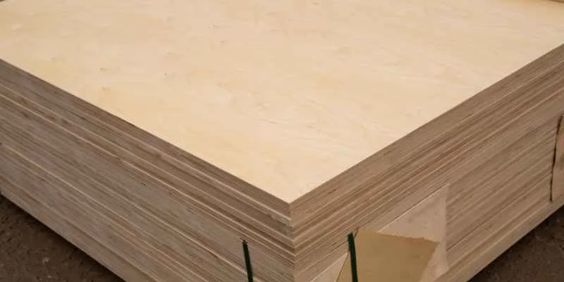 A stack of plywood sheets showing the layered veneer edge construction