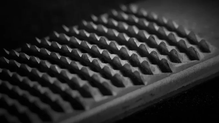 Close-up of the cutting teeth on a wood rasp, the tool used to shape carved plywood edges