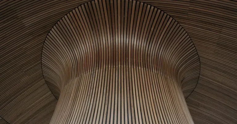architectural wood slat ceiling design with warm brown tones