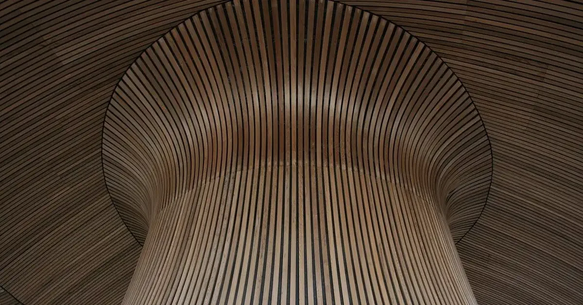 architectural wood slat ceiling design with warm brown tones