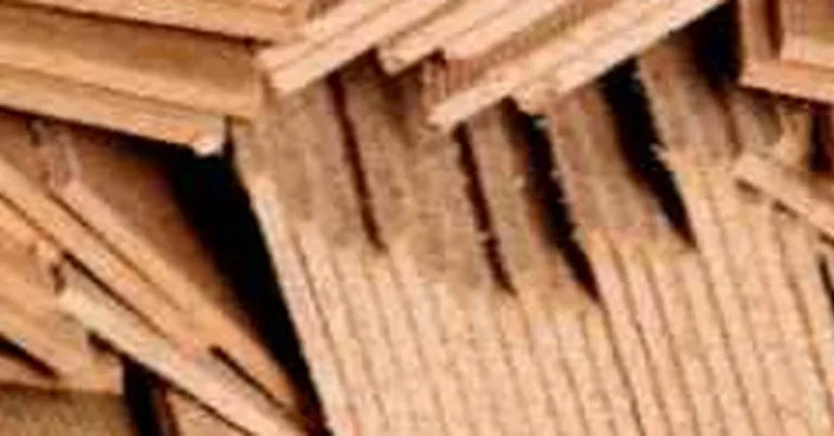 stacked plywood offcuts and scrap sheets from a woodworking project