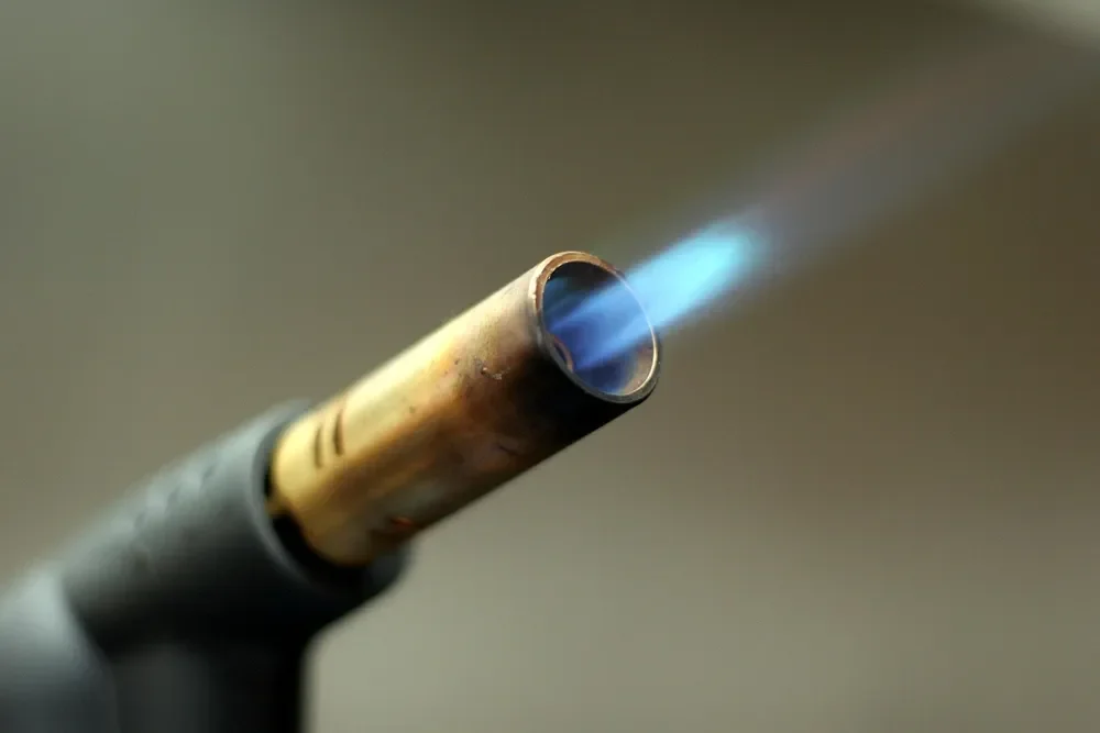 Propane torch tip with a blue flame