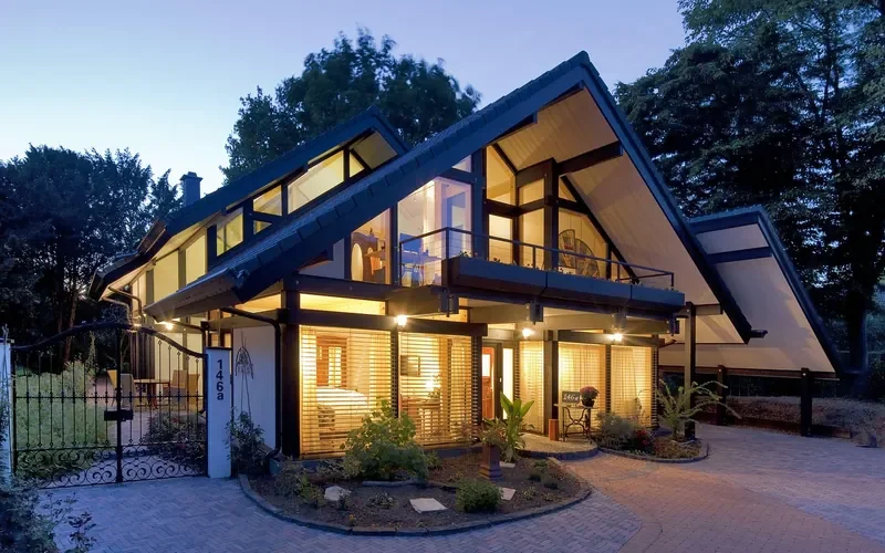 Modern timber-framed house with exposed wood frame members Modern timber-framed house with exposed wood frame members