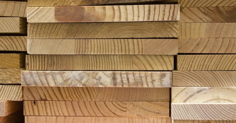 stacked dimensional lumber boards ready for garage storage