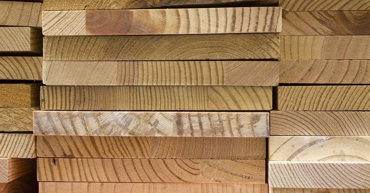 stacked dimensional lumber boards ready for garage storage