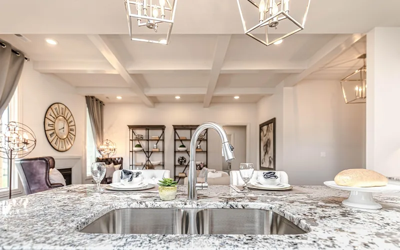 undermount stainless steel sink cut into a granite kitchen countertop