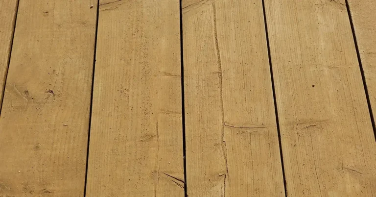 weathered wood deck planks showing splintering grain and rough surface texture