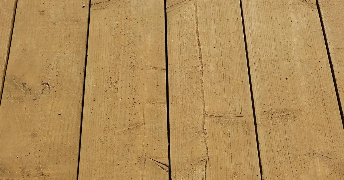 weathered wood deck planks showing splintering grain and rough surface texture