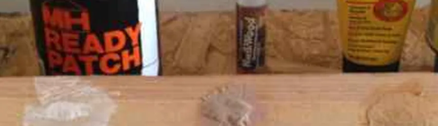 Five wood filler products from Lowe's applied as test patches on a pine board