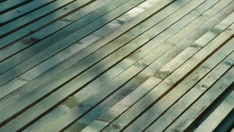 Row of wood lath strips laid side by side with narrow gaps between them