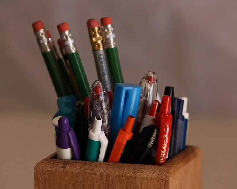 Solid wood block pen holder holding pens and pencils